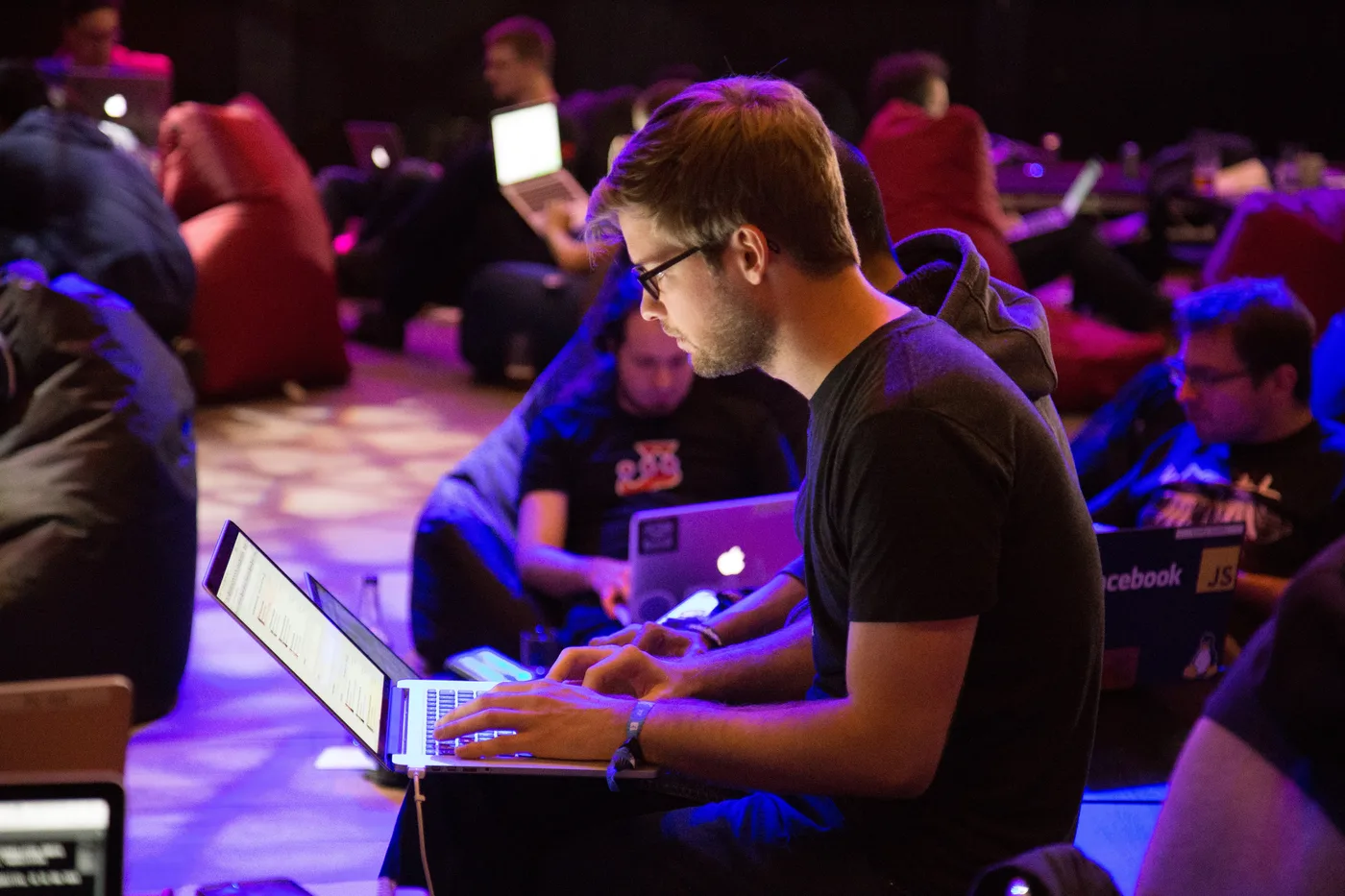 Developer working on a laptop at a workshop